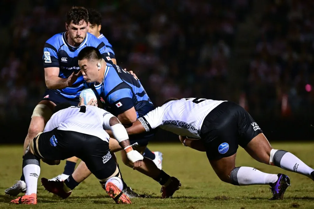 Japan carry into the Fiji defence during the 2026 Pacific Nations Cup final in Tokyo