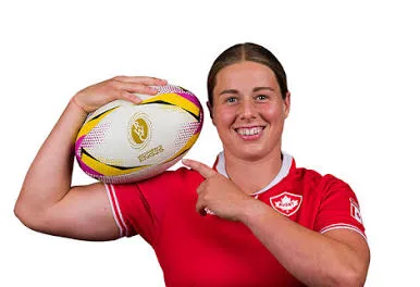 Sophie de Goede holding a rugby ball in her Canada jersey