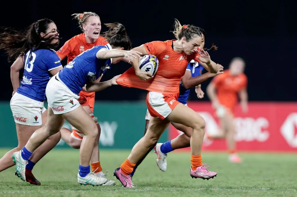 Netherlands ball carrier breaks through the Samoa defense during the 2026 WXV Global Series Challenger