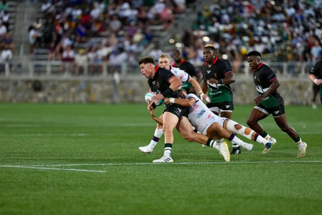 Rugby player being tackled as World Rugby introduces new hip-drop tackle law